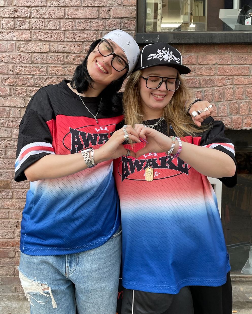 Buffalo Exchange employees hugging and making a heart symbol