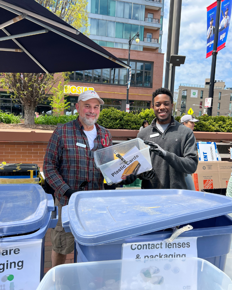 Reduce Waste Chicago volunteers with recycling bins